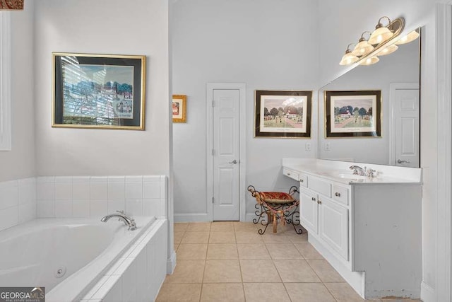 2002 Ivy Ridge Rd SE, Smyrna, GA 30080 - full bathroom featuring vanity, a jetted tub, and tile patterned floors