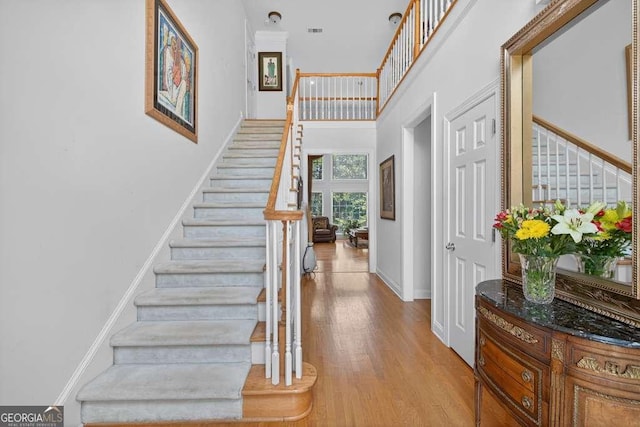2002 Ivy Ridge Rd SE, Smyrna, GA 30080 - foyer featuring stairway, wood finished floors, and a high ceiling