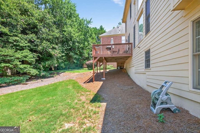 2002 Ivy Ridge Rd SE, Smyrna, GA 30080 - view of green lawn featuring a wooden deck