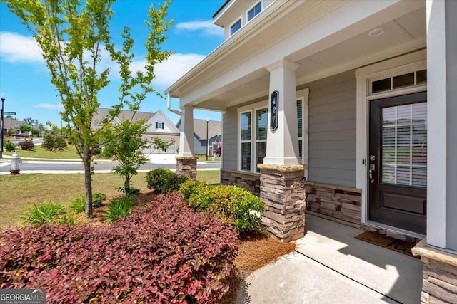 427 Bluffs View Ln, Canton, GA 30114 - doorway to property with stone siding and covered porch