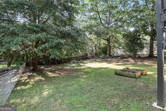 67 Woodlawn Dr, Toccoa, GA 30577 - fenced backyard featuring a garden