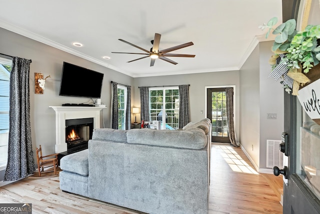 67 Woodlawn Dr, Toccoa, GA 30577 - living area with ornamental molding, a lit fireplace, a ceiling fan, light wood-type flooring, and recessed lighting