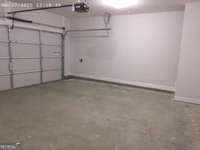 299 Mcclelland Loop NE, Ludowici, GA 31316 - garage with baseboards and a garage door opener