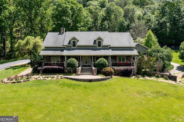 4167 Downings Creek Rd, Hayesville, NC 28904 - farmhouse inspired home featuring a front lawn, a chimney, and a wooded view