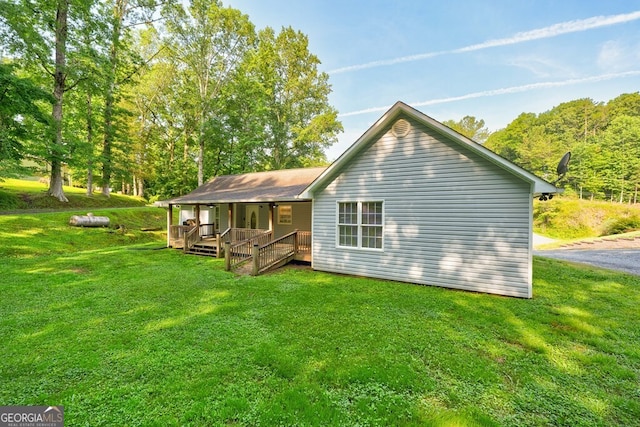 30 Red Bird Ln, Ellijay, GA 30540 - back of house with covered porch and a lawn