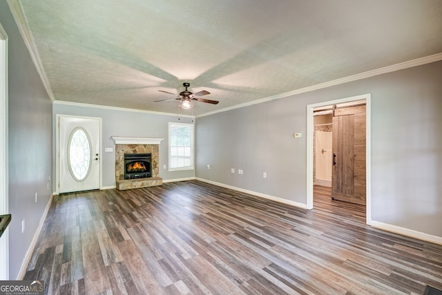 30 Red Bird Ln, Ellijay, GA 30540 - unfurnished living room with wood finished floors, a ceiling fan, a fireplace, and crown molding