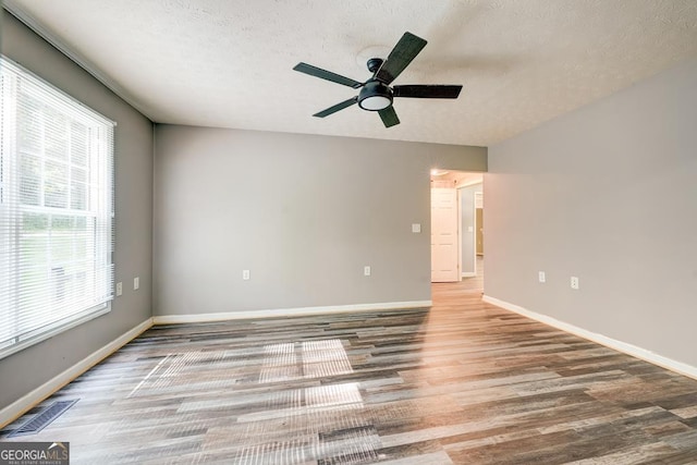 30 Red Bird Ln, Ellijay, GA 30540 - unfurnished room featuring wood finished floors, ceiling fan, and a textured ceiling