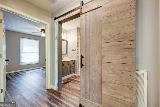 30 Red Bird Ln, Ellijay, GA 30540 - hall with wood finished floors and a barn door