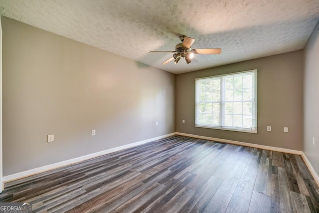 30 Red Bird Ln, Ellijay, GA 30540 - unfurnished room featuring dark wood-style floors, a ceiling fan, and a textured ceiling