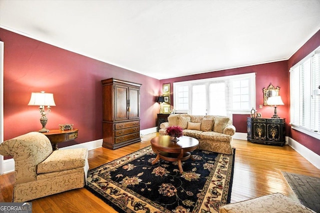 3579 Overlook Ave, Macon, GA 31204 - living area with healthy amount of natural light, wood finished floors, and ornamental molding