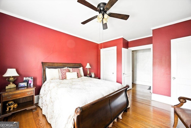 3579 Overlook Ave, Macon, GA 31204 - bedroom featuring wood finished floors, ornamental molding, and a ceiling fan