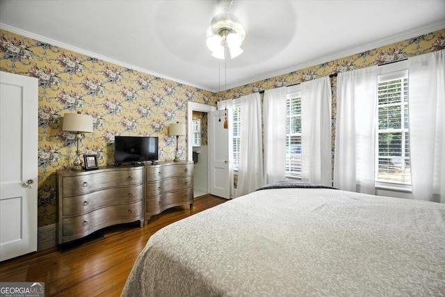 3579 Overlook Ave, Macon, GA 31204 - bedroom featuring wood finished floors, crown molding, wallpapered walls, and a ceiling fan