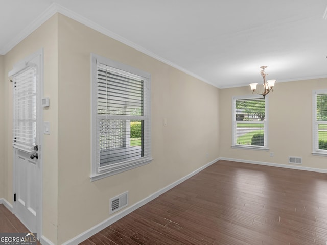 117 Thomas St, Griffin, GA 30224 - unfurnished room featuring dark wood finished floors, a chandelier, and ornamental molding