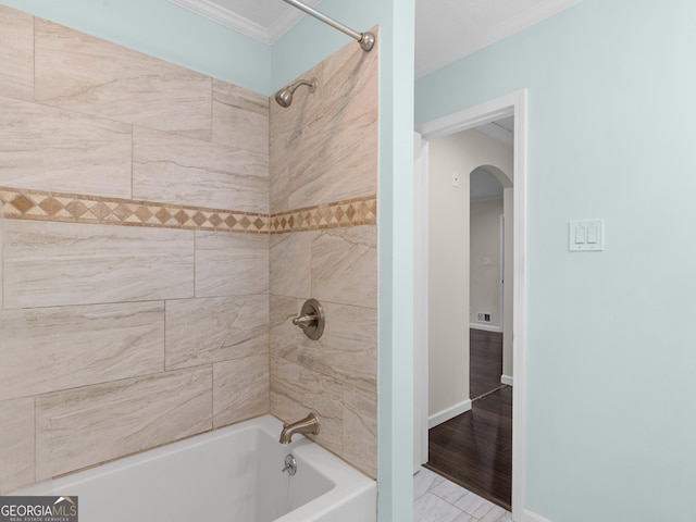 117 Thomas St, Griffin, GA 30224 - bathroom featuring washtub / shower combination and ornamental molding