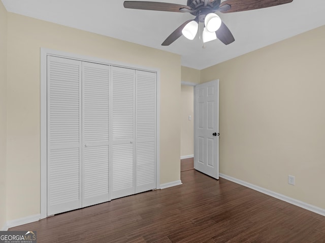 117 Thomas St, Griffin, GA 30224 - unfurnished bedroom with dark wood-style flooring, a closet, and a ceiling fan