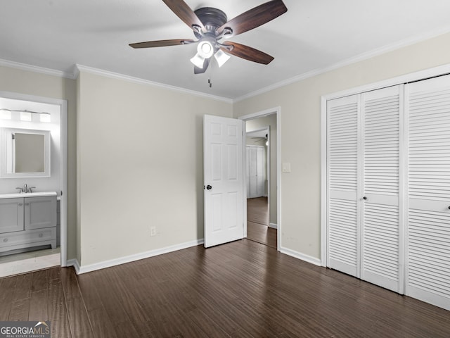 117 Thomas St, Griffin, GA 30224 - unfurnished bedroom with dark wood finished floors, crown molding, a closet, ensuite bathroom, and a ceiling fan