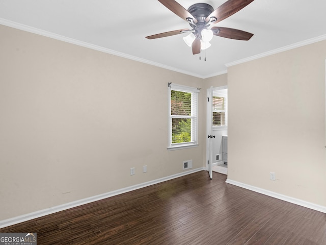 117 Thomas St, Griffin, GA 30224 - spare room with a ceiling fan, ornamental molding, and dark wood-style floors