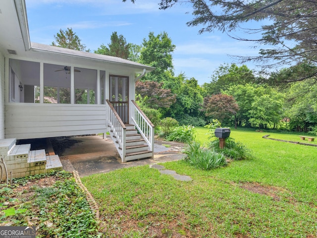 117 Thomas St, Griffin, GA 30224 - view of grassy yard featuring ceiling fan and a sunroom