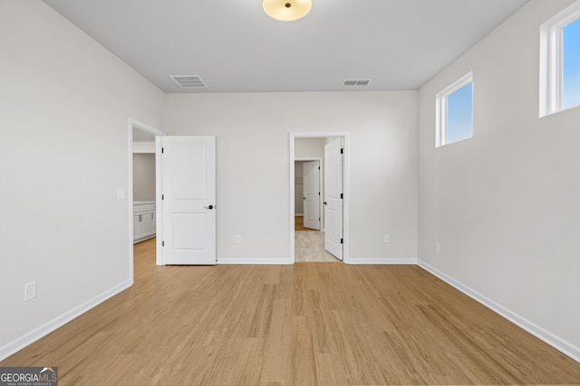 1692 Juniper Berry Way, Loganville, GA 30052 - unfurnished bedroom with light wood finished floors and a spacious closet