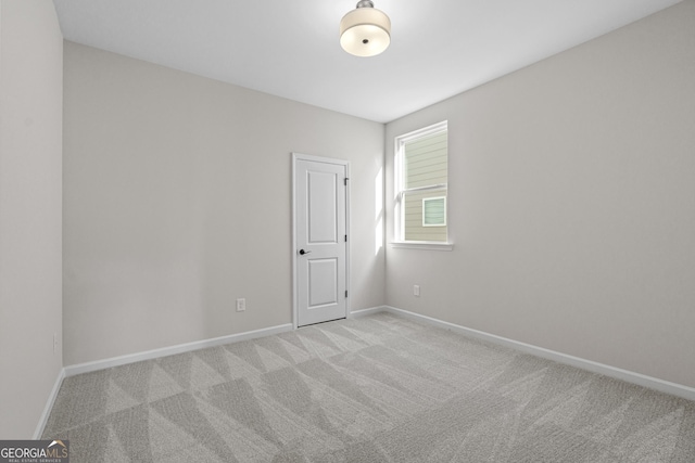 1692 Juniper Berry Way, Loganville, GA 30052 - empty room with light colored carpet and baseboards