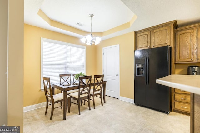 112 Huntwood Ln, Kathleen, GA 31047 - dining area with a tray ceiling and a chandelier