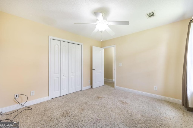 112 Huntwood Ln, Kathleen, GA 31047 - unfurnished bedroom with a closet, carpet flooring, and ceiling fan