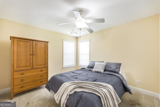 112 Huntwood Ln, Kathleen, GA 31047 - bedroom with light colored carpet, ceiling fan, and a textured ceiling