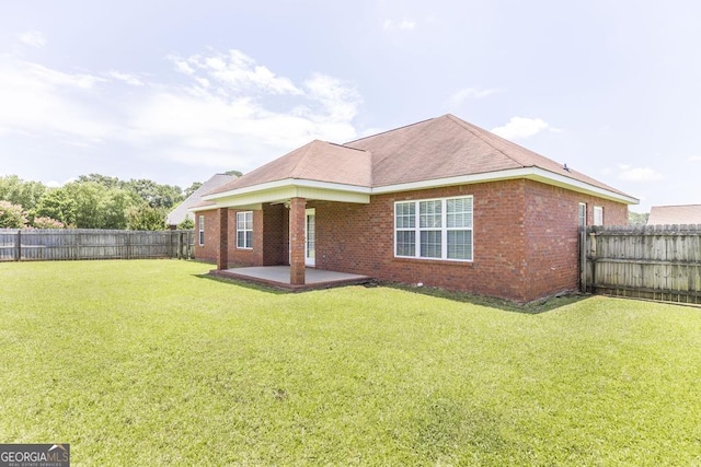 112 Huntwood Ln, Kathleen, GA 31047 - back of property featuring a patio area, a fenced backyard, and brick siding