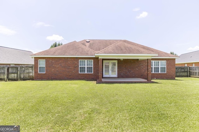 112 Huntwood Ln, Kathleen, GA 31047 - back of house with french doors, a fenced backyard, a patio, brick siding, and roof with shingles