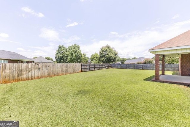112 Huntwood Ln, Kathleen, GA 31047 - fenced backyard with a patio