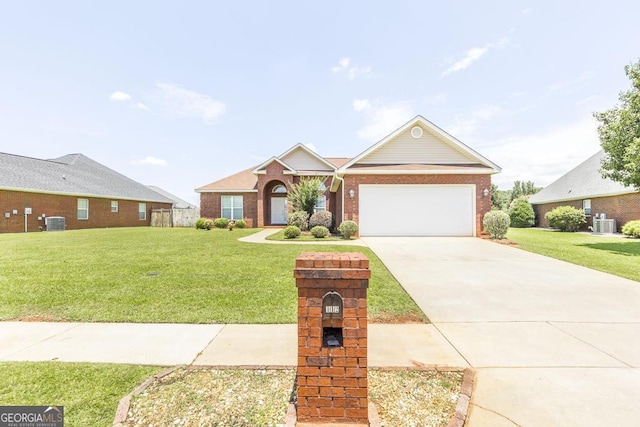 112 Huntwood Ln, Kathleen, GA 31047 - view of front of home with brick siding, a front lawn, an attached garage, and driveway