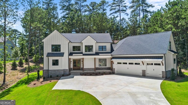 1131 Glen Eagle Dr, Greensboro, GA 30642 - modern farmhouse style home with a garage, board and batten siding, concrete driveway, and a shingled roof