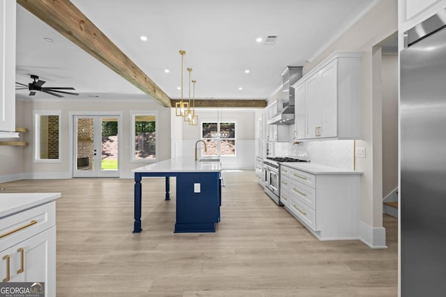 1131 Glen Eagle Dr, Greensboro, GA 30642 - kitchen with premium appliances, light countertops, white cabinetry, ceiling fan, and recessed lighting