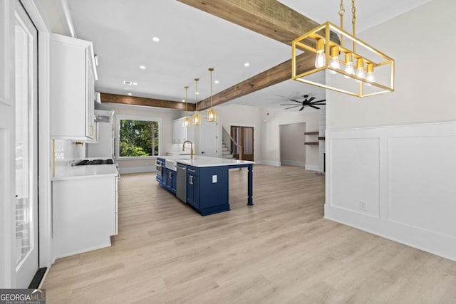 1131 Glen Eagle Dr, Greensboro, GA 30642 - kitchen with blue cabinets, white cabinets, light countertops, light wood-type flooring, and recessed lighting