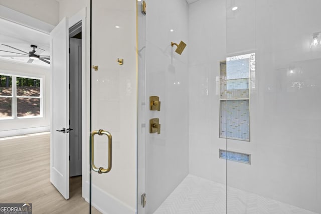 1131 Glen Eagle Dr, Greensboro, GA 30642 - bathroom with a shower stall, a ceiling fan, and wood finished floors
