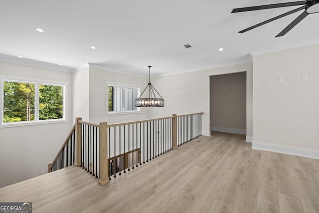 1131 Glen Eagle Dr, Greensboro, GA 30642 - spare room with ceiling fan, wood finished floors, a chandelier, recessed lighting, and ornamental molding