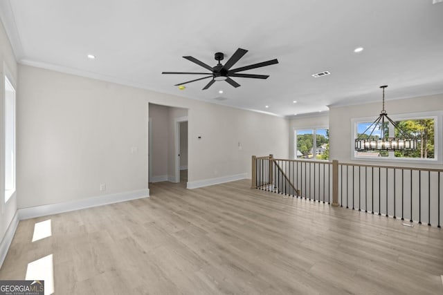 1131 Glen Eagle Dr, Greensboro, GA 30642 - spare room featuring ornamental molding, a chandelier, light wood-type flooring, recessed lighting, and a ceiling fan