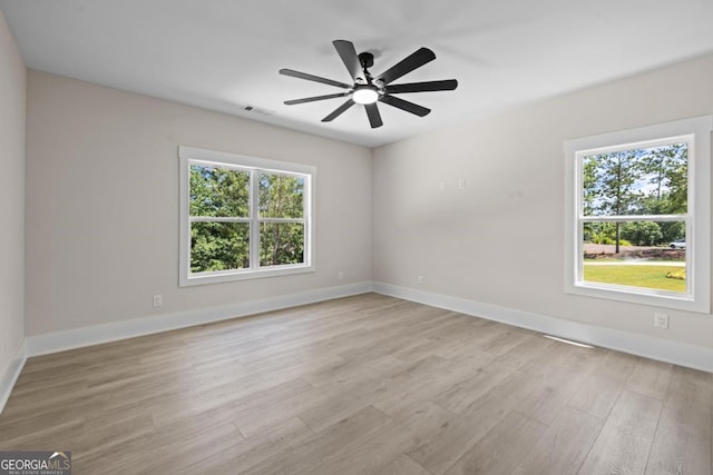 1131 Glen Eagle Dr, Greensboro, GA 30642 - unfurnished room featuring light wood-style floors and ceiling fan