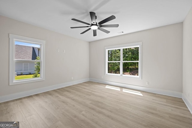 1131 Glen Eagle Dr, Greensboro, GA 30642 - empty room with light wood finished floors and a ceiling fan