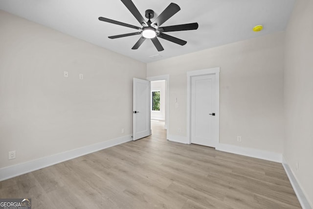 1131 Glen Eagle Dr, Greensboro, GA 30642 - empty room featuring a ceiling fan, light wood-style floors, and a smoke detector