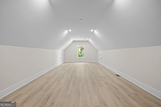 1131 Glen Eagle Dr, Greensboro, GA 30642 - additional living space with vaulted ceiling and light wood-style flooring