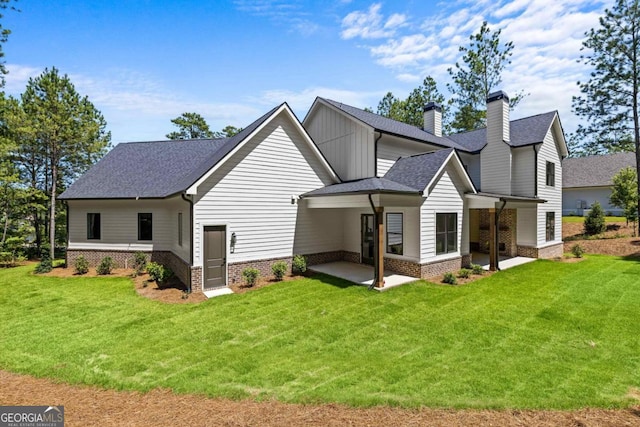 1131 Glen Eagle Dr, Greensboro, GA 30642 - rear view of property with roof with shingles, a yard, and a chimney