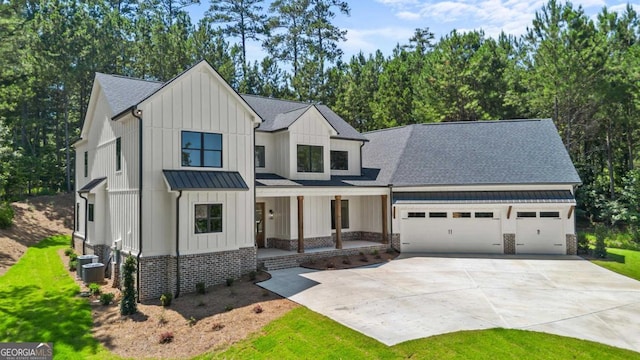 1131 Glen Eagle Dr, Greensboro, GA 30642 - modern inspired farmhouse with board and batten siding, a garage, concrete driveway, covered porch, and a shingled roof