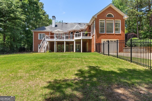 660 Milton Dr, Mcdonough, GA 30252 - rear view of house with stairs, brick siding, a deck, a garage, and a chimney