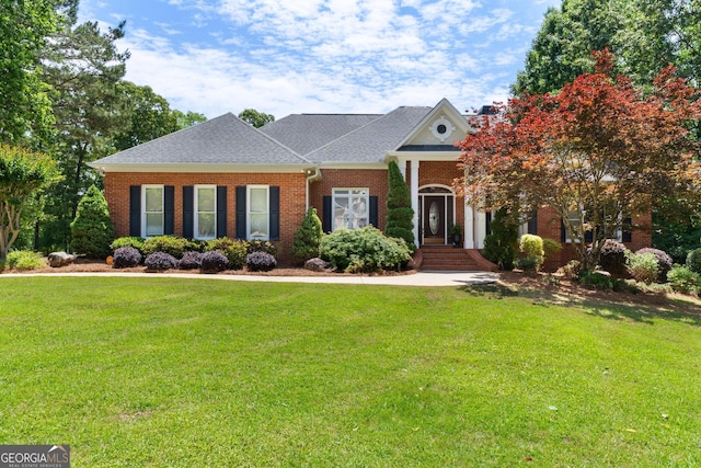 660 Milton Dr, Mcdonough, GA 30252 - greek revival inspired property featuring brick siding, a front yard, and a shingled roof