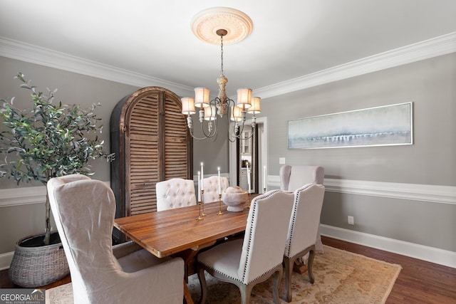 660 Milton Dr, Mcdonough, GA 30252 - dining space featuring a chandelier, wood finished floors, and ornamental molding