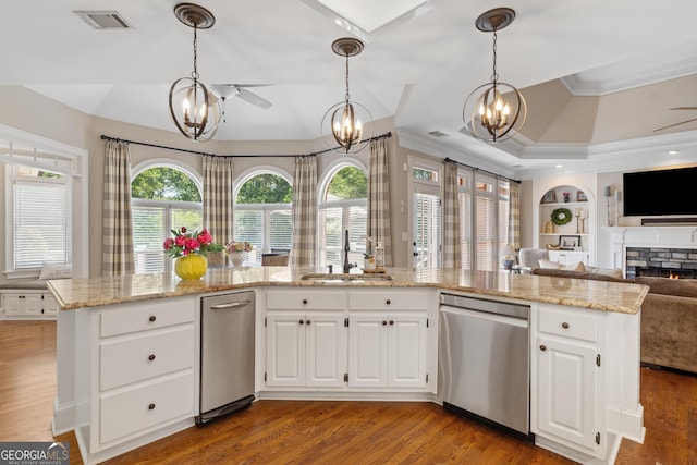 660 Milton Dr, Mcdonough, GA 30252 - kitchen with stainless steel dishwasher, a chandelier, open floor plan, ornamental molding, and wood finished floors