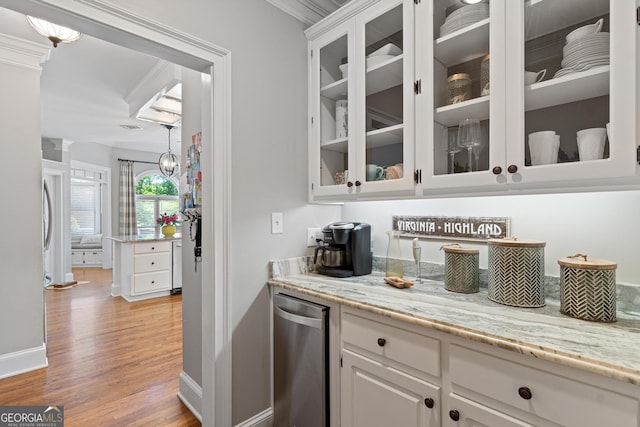 660 Milton Dr, Mcdonough, GA 30252 - bar area with light wood-style floors and ornamental molding
