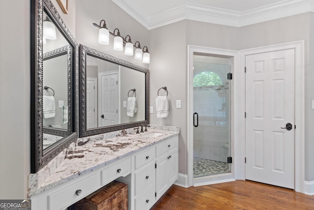 660 Milton Dr, Mcdonough, GA 30252 - full bathroom with a stall shower, ornamental molding, vanity, and wood finished floors