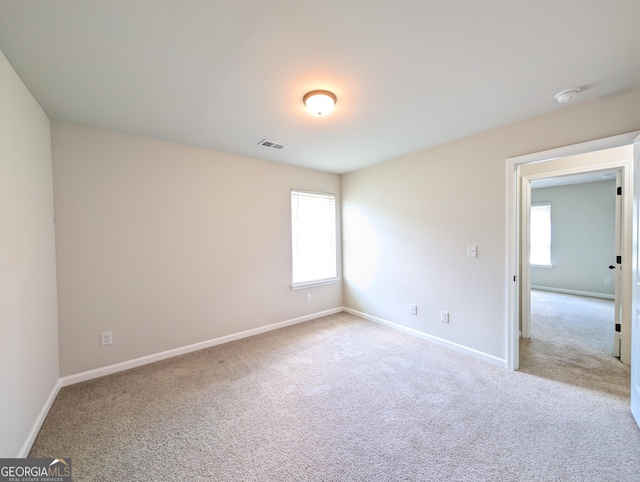 120 Magnaview Dr, Mcdonough, GA 30253 - spare room featuring light carpet and a smoke detector